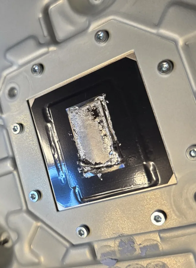 Liquid metal thermal compound that has migrated off a PS5 processor die, exposing bare silicon